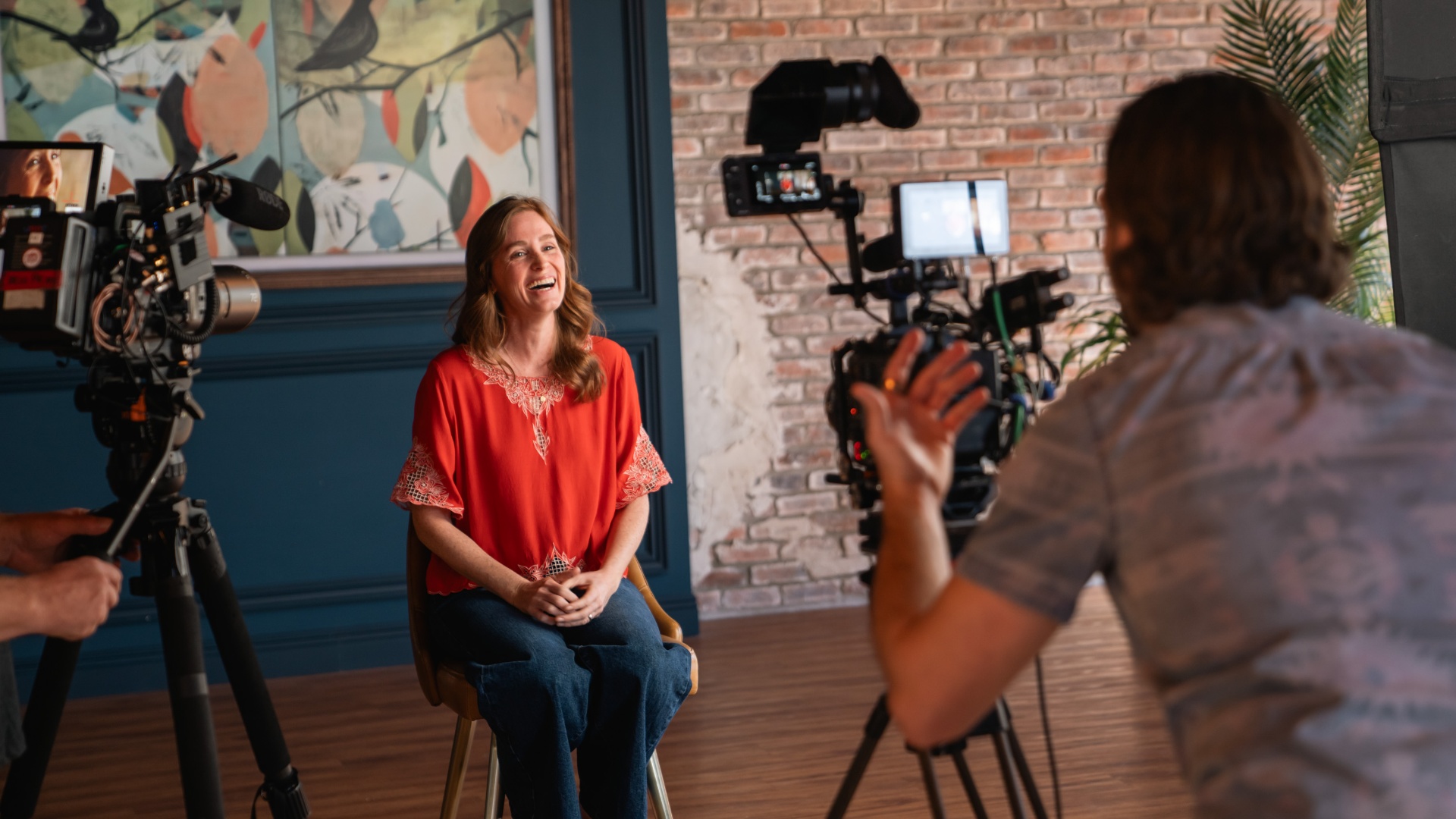 Leader on camera in the Storyhouse studio — natural light, cinematic framing